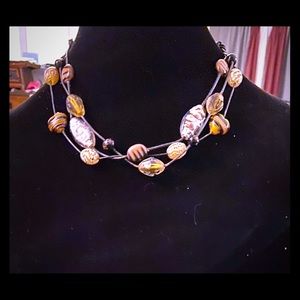 Neutral colored bead choker.